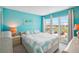 Light and airy bedroom features a double bed and water view at 343 Rex Pl # F, Madeira Beach, FL 33708