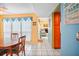 Dining area with view into living room and kitchen at 343 Rex Pl # F, Madeira Beach, FL 33708