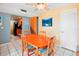 Dining room with wood table and kitchen access at 343 Rex Pl # F, Madeira Beach, FL 33708