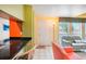 Kitchen with black countertops, a breakfast bar, and access to the living room at 343 Rex Pl # F, Madeira Beach, FL 33708