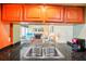 Kitchen with granite counters and view of living room at 343 Rex Pl # F, Madeira Beach, FL 33708