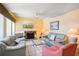 Living room with fireplace, two couches, and a coffee table at 343 Rex Pl # F, Madeira Beach, FL 33708
