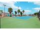 Well-maintained tennis court with green surface and surrounding fence at 343 Rex Pl # F, Madeira Beach, FL 33708