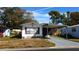 Mobile home exterior with carport and landscaped yard at 34421 Countryside Dr, Wesley Chapel, FL 33543