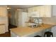Eat-in kitchen with island and modern appliances at 34421 Countryside Dr, Wesley Chapel, FL 33543