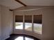 Living area features large bay windows and hardwood floors at 34421 Countryside Dr, Wesley Chapel, FL 33543
