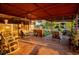 Relaxing back patio with rocking chairs and covered seating area at 4506 24Th S Ave, Tampa, FL 33619