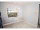 Small bedroom with tile floors and a window with blinds at 4506 24Th S Ave, Tampa, FL 33619