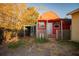 Small red barn-style guest house with adjacent chicken coop at 4506 24Th S Ave, Tampa, FL 33619