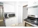 Updated kitchen with white cabinets and granite countertops at 4506 24Th S Ave, Tampa, FL 33619