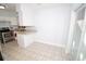 Kitchen with an eat-in area and sliding glass doors to patio at 4506 24Th S Ave, Tampa, FL 33619