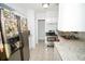 Modern kitchen with stainless steel appliances and granite countertops at 4506 24Th S Ave, Tampa, FL 33619