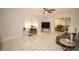 Living room with tile flooring, large TV, and comfortable seating at 4506 24Th S Ave, Tampa, FL 33619