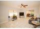 Bright living room with tile floors, a large TV, and comfortable seating at 4506 24Th S Ave, Tampa, FL 33619