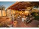 Rustic covered patio with rocking chairs, plants, and fire pit at 4506 24Th S Ave, Tampa, FL 33619