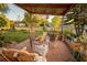 Relaxing patio with fire pit, rocking chairs, and potted plants at 4506 24Th S Ave, Tampa, FL 33619