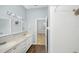 Double vanity bathroom with shower and hardwood floors at 5301 Watson Rd, Riverview, FL 33578