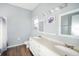 Double vanity bathroom with updated fixtures and flooring at 5301 Watson Rd, Riverview, FL 33578