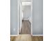 Bathroom view from doorway, showcasing hardwood floors at 5301 Watson Rd, Riverview, FL 33578