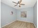 Spacious bedroom with hardwood floors and ceiling fan at 5301 Watson Rd, Riverview, FL 33578