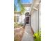 Front entry with a paved walkway, mature landscaping, and a dark door at 5301 Watson Rd, Riverview, FL 33578