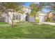 House exterior featuring a well-maintained lawn and a two-car garage at 5301 Watson Rd, Riverview, FL 33578