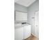 Laundry room with washer, dryer, and additional storage cabinets at 5301 Watson Rd, Riverview, FL 33578