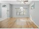 Living room featuring hardwood floors and a large window at 5301 Watson Rd, Riverview, FL 33578