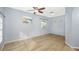 Bright living room featuring hardwood floors and ceiling fan at 5301 Watson Rd, Riverview, FL 33578