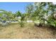 Private backyard with patio furniture under tree shade at 534 19Th Nw St, Ruskin, FL 33570