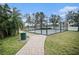 Community basketball court with chain link fence and paved surface at 534 19Th Nw St, Ruskin, FL 33570