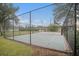 Enclosed community basketball court with a chain link fence at 534 19Th Nw St, Ruskin, FL 33570