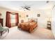 Spacious bedroom with ceiling fan and large window at 534 19Th Nw St, Ruskin, FL 33570