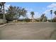 View of tennis court and parking lot at 534 19Th Nw St, Ruskin, FL 33570