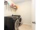 Laundry room with washer, dryer, and shelving at 534 19Th Nw St, Ruskin, FL 33570