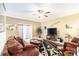 Spacious living room featuring a cozy seating area and large TV at 534 19Th Nw St, Ruskin, FL 33570