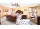 Main bedroom with ceiling fan and ensuite bathroom access at 534 19Th Nw St, Ruskin, FL 33570