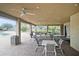 Covered patio area with tables and chairs near pool at 534 19Th Nw St, Ruskin, FL 33570