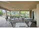 Covered patio area with tables and chairs near pool at 534 19Th Nw St, Ruskin, FL 33570
