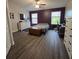 Main bedroom with a bed, dresser, and an office area at 558 Harbor Ridge Dr, Palm Harbor, FL 34683