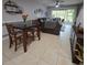 Small dining area with a square table and chairs near the living room at 558 Harbor Ridge Dr, Palm Harbor, FL 34683