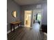 Hallway with wood-look floors and access to bedrooms and bath at 558 Harbor Ridge Dr, Palm Harbor, FL 34683