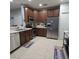 Spacious kitchen with stainless steel appliances and ample cabinetry at 558 Harbor Ridge Dr, Palm Harbor, FL 34683