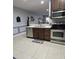 Modern kitchen with stainless steel appliances and a breakfast bar at 558 Harbor Ridge Dr, Palm Harbor, FL 34683