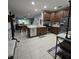 Open kitchen with stainless steel appliances and views of the living room at 558 Harbor Ridge Dr, Palm Harbor, FL 34683
