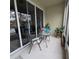 Screened-in patio with table and chairs, overlooking a pond at 558 Harbor Ridge Dr, Palm Harbor, FL 34683