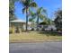 Community pool area with palm trees and fence at 558 Harbor Ridge Dr, Palm Harbor, FL 34683