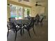 Covered patio furniture near the community pool at 558 Harbor Ridge Dr, Palm Harbor, FL 34683