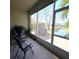 Relaxing screened porch overlooking a peaceful lake at 558 Harbor Ridge Dr, Palm Harbor, FL 34683