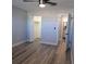 Spacious bedroom with wood-look floors and walk-in closet at 5660 80Th N St # C307, St Petersburg, FL 33709